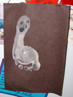 child footprint makes ghost art